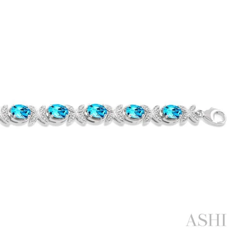 1/10 ctw Round Cut Diamond & 7x5MM Oval Cut Blue Topaz Semi Precious Bracelet in Silver