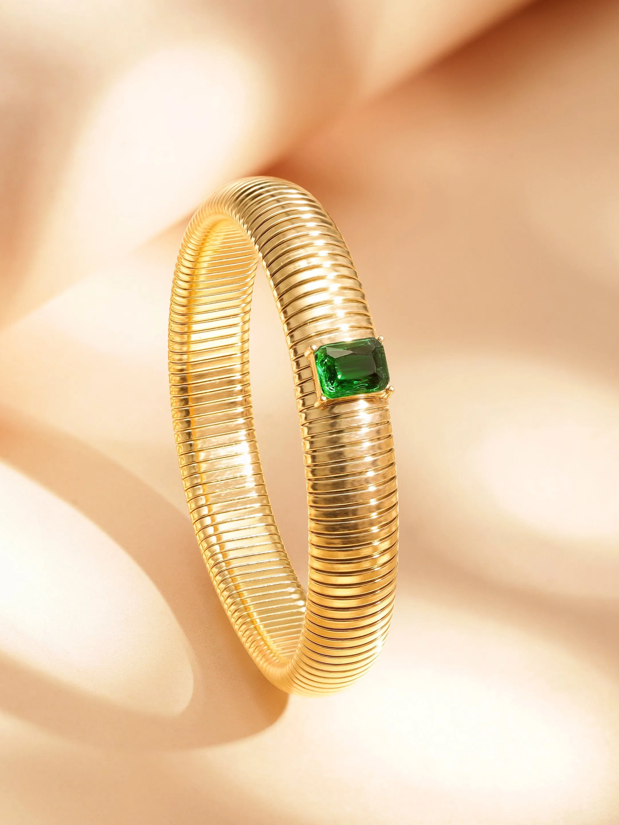 Rubans Voguish 18k Gold Plated  water proof Stainless Twilight Spiral  of shimmer  with Green stone bracelet