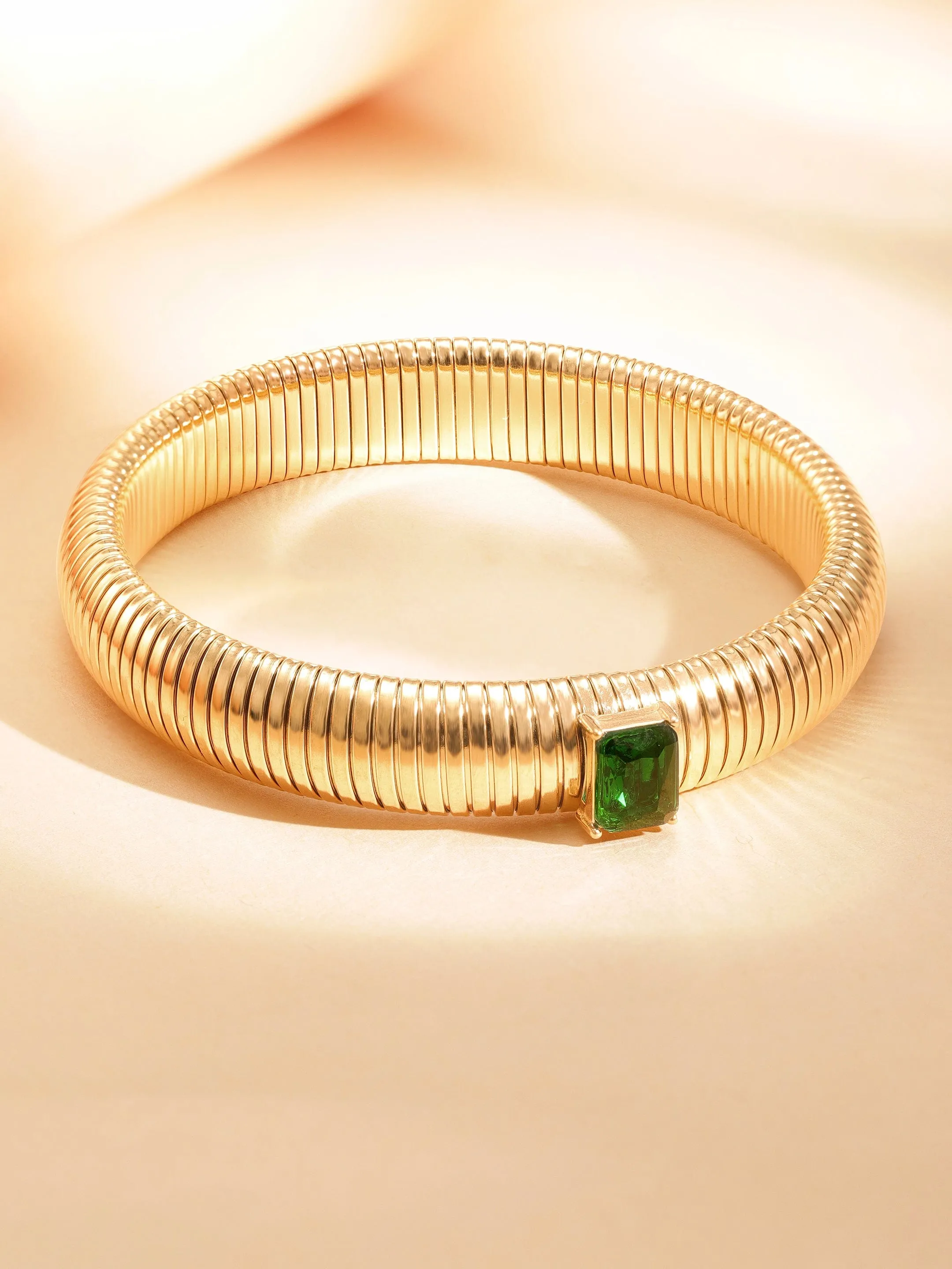 Rubans Voguish 18k Gold Plated  water proof Stainless Twilight Spiral  of shimmer  with Green stone bracelet